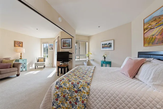 a bedroom with a bed and a couch