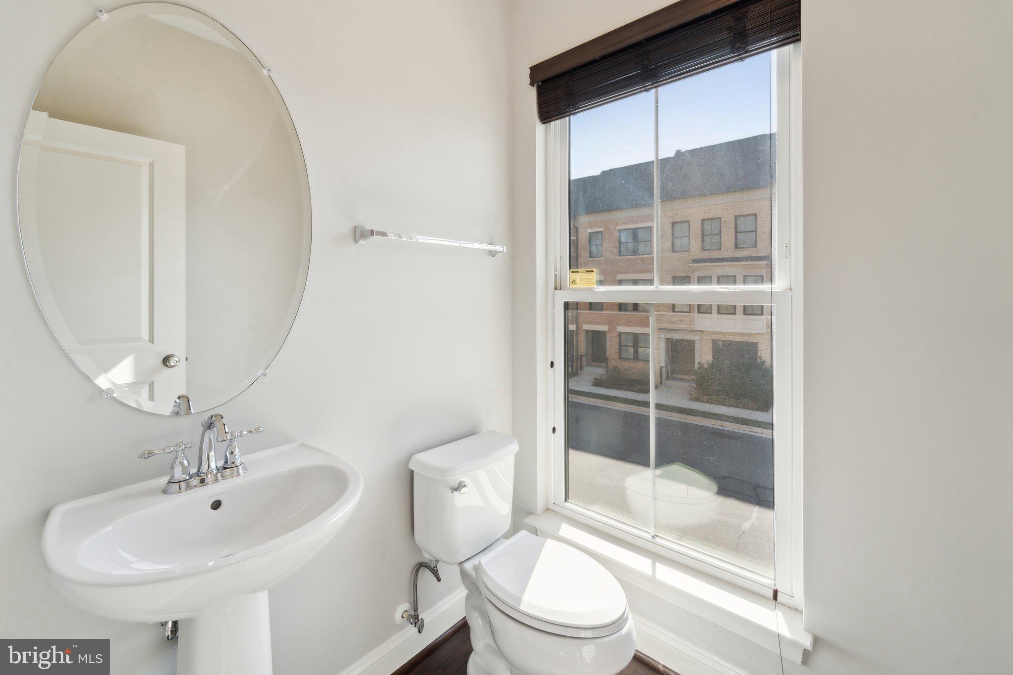 20398 Codman Drive Ashburn, VA 20147 - Photo 18 of 39 a bathroom with a sink toilet and shower