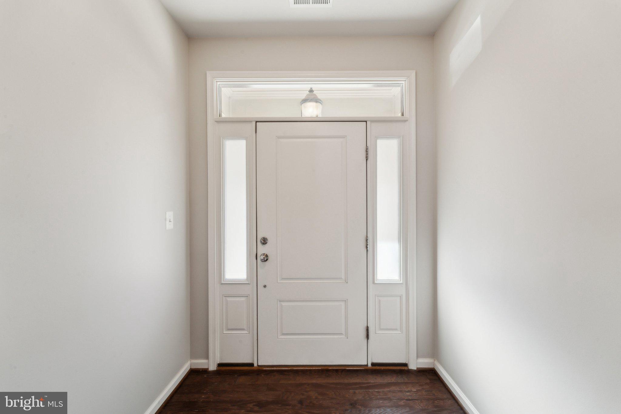20398 Codman Drive Ashburn, VA 20147 - Photo 2 of 39 a view of front door with wooden floor