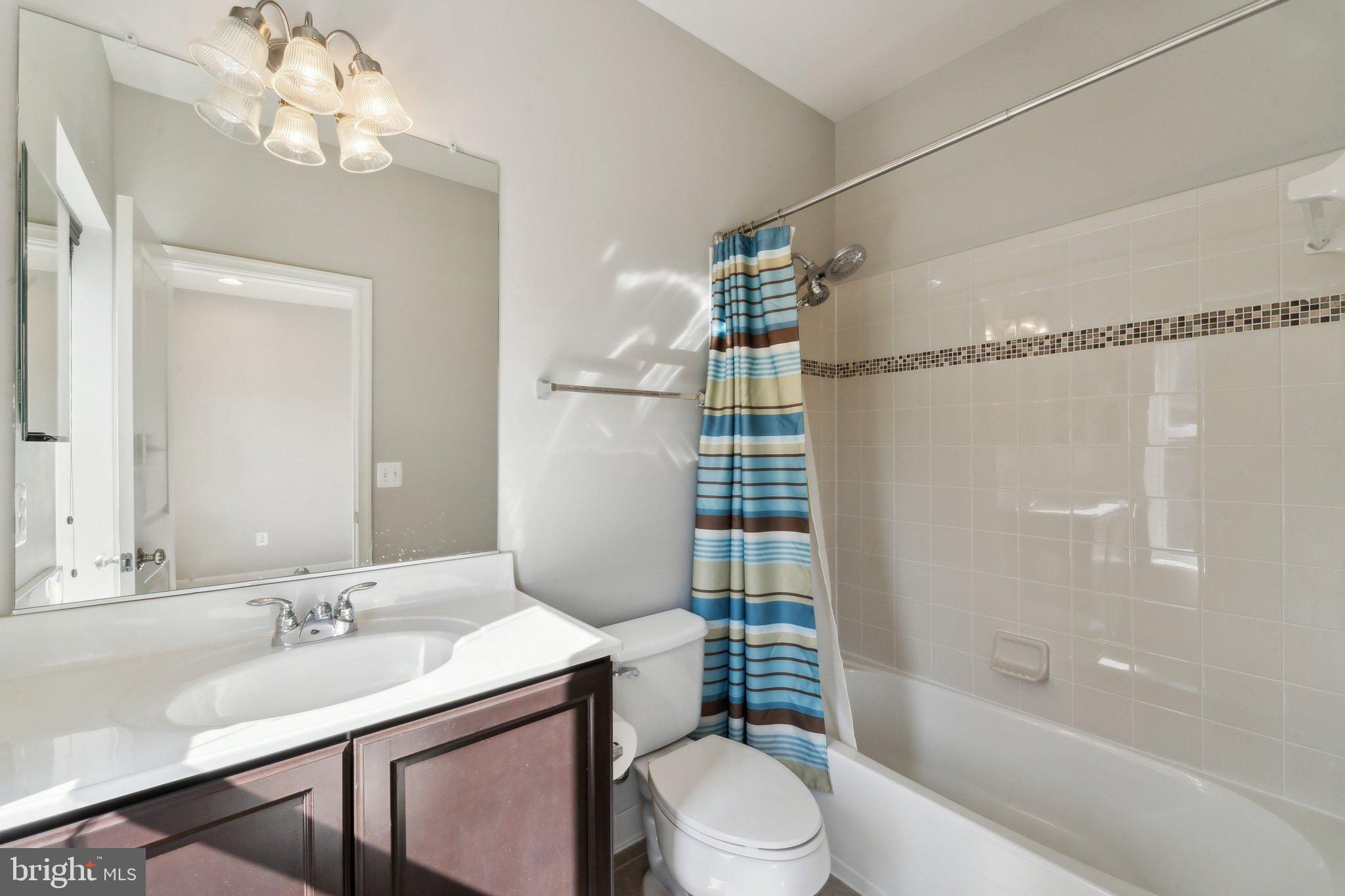 20398 Codman Drive Ashburn, VA 20147 - Photo 35 of 39 a bathroom with a sink toilet tub and shower