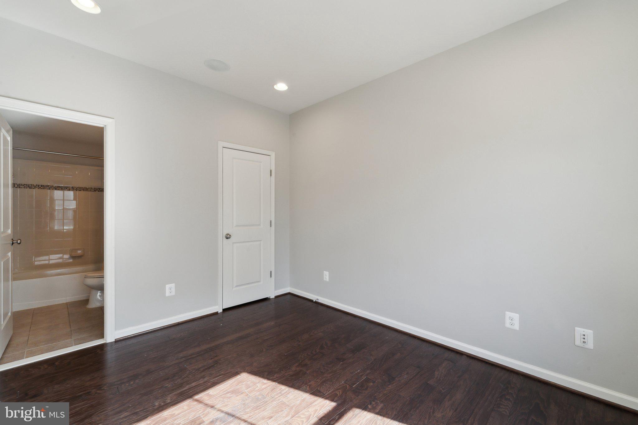 20398 Codman Drive Ashburn, VA 20147 - Photo 4 of 39 wooden floor in an empty room