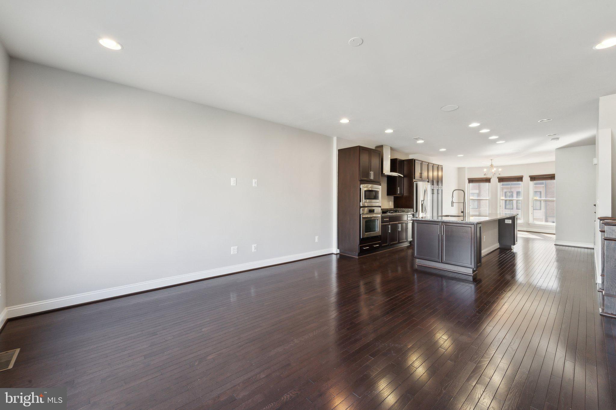 20398 Codman Drive Ashburn, VA 20147 - Photo 9 of 39 a view of kitchen with cabinets and wooden floor