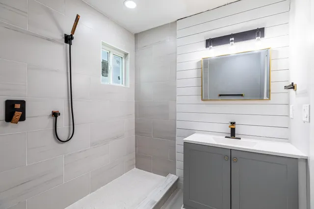 a bathroom with a sink and a mirror