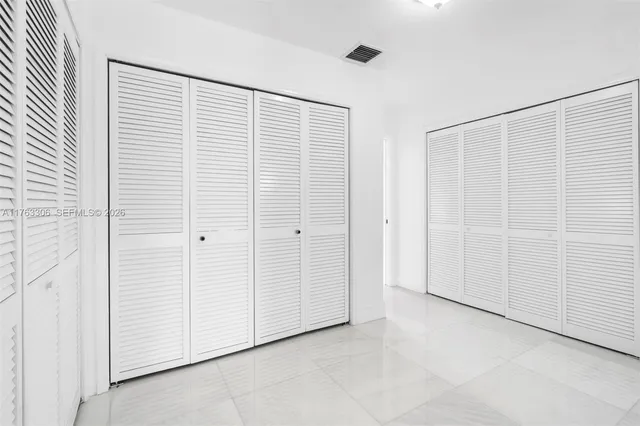 a potted plant sitting on the side of a brick building