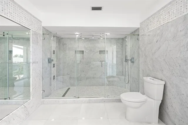 a potted plant sitting on the side of a brick building