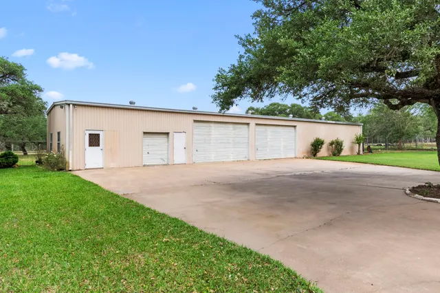 a view of backyard of house and outdoor space