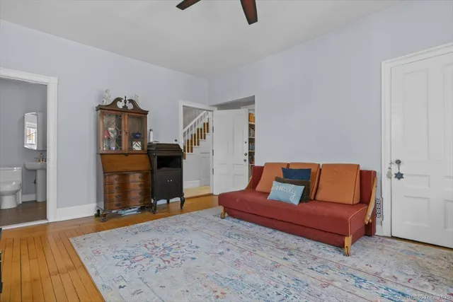 a living room with furniture and a rug