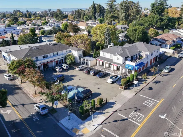 an aerial view of multiple houses with yard