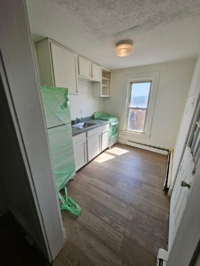 539 3rd Street, Unit 537 Pitcairn, PA 15140 - Photo 2 of 11 a kitchen with a sink and a stove top oven