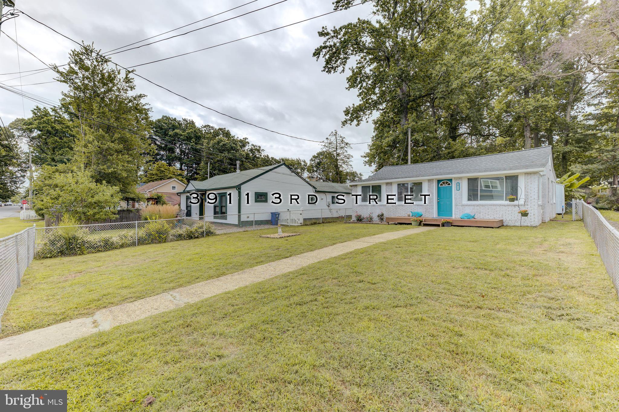 3911 3rd Street North Beach, MD 20714 - Photo 1 of 48 a swimming pool view with outdoor seating