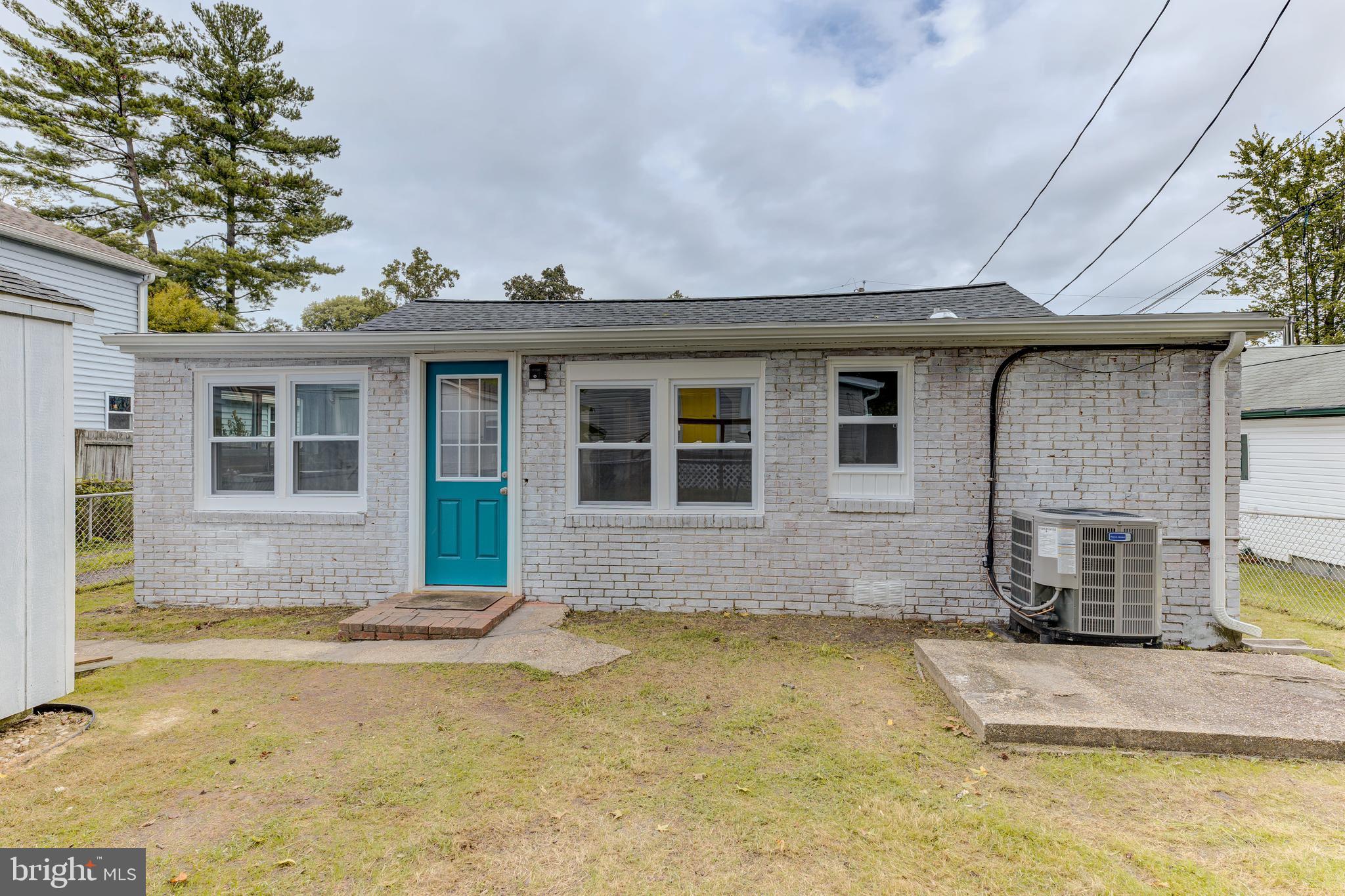 3911 3rd Street North Beach, MD 20714 - Photo 19 of 48 a front view of a house with swimming pool