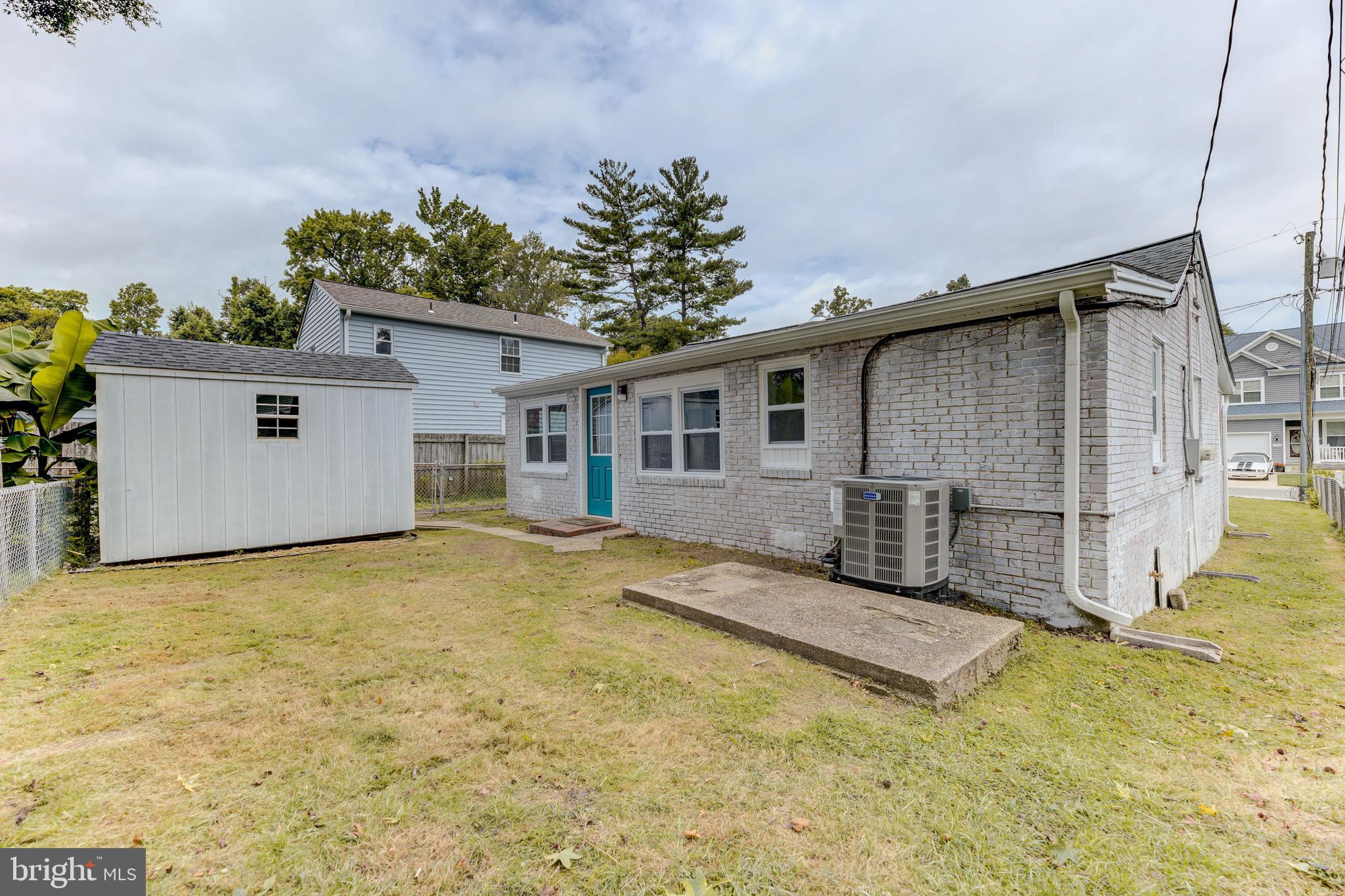 3911 3rd Street North Beach, MD 20714 - Photo 20 of 48 a view of a house with a backyard