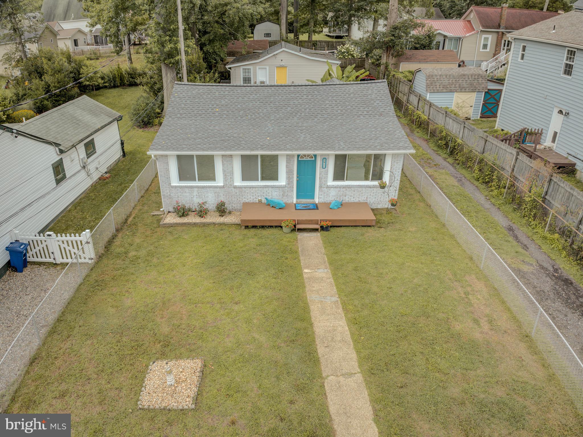 3911 3rd Street North Beach, MD 20714 - Photo 26 of 48 a aerial view of a house with swimming pool