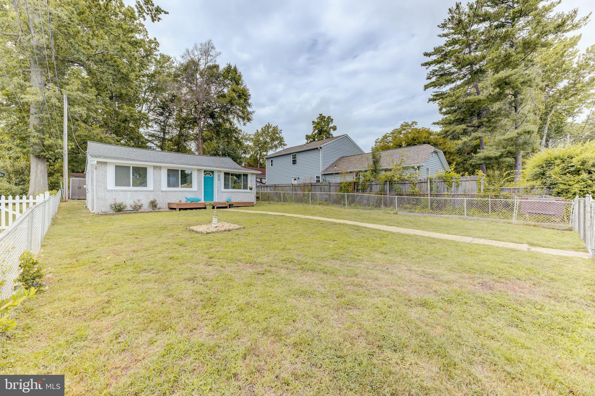 3911 3rd Street North Beach, MD 20714 - Photo 3 of 48 a view of house with a garden