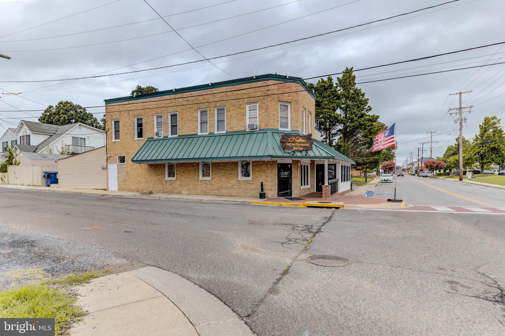3911 3rd Street North Beach, MD 20714 - Photo 32 of 48 a front view of a house with a road