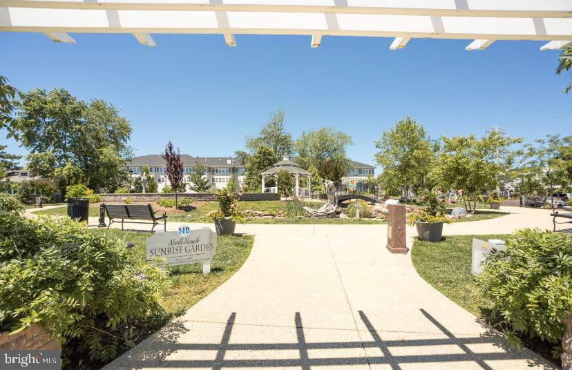 3911 3rd Street North Beach, MD 20714 - Photo 37 of 48 a view of a swimming pool and an outdoor space