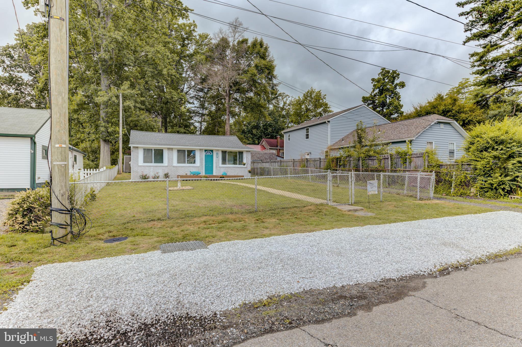 3911 3rd Street North Beach, MD 20714 - Photo 5 of 48 a view of a house with a yard