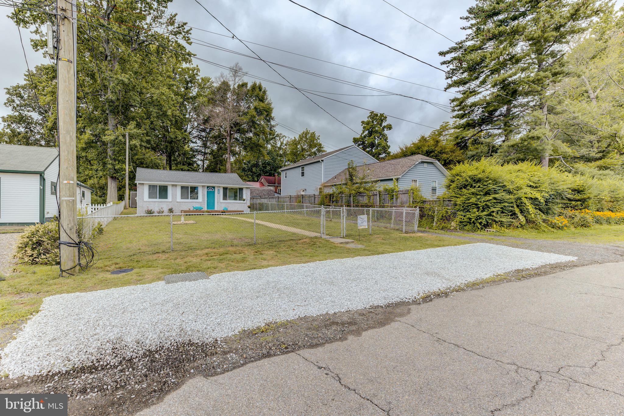 3911 3rd Street North Beach, MD 20714 - Photo 6 of 48 a view of a house with a yard