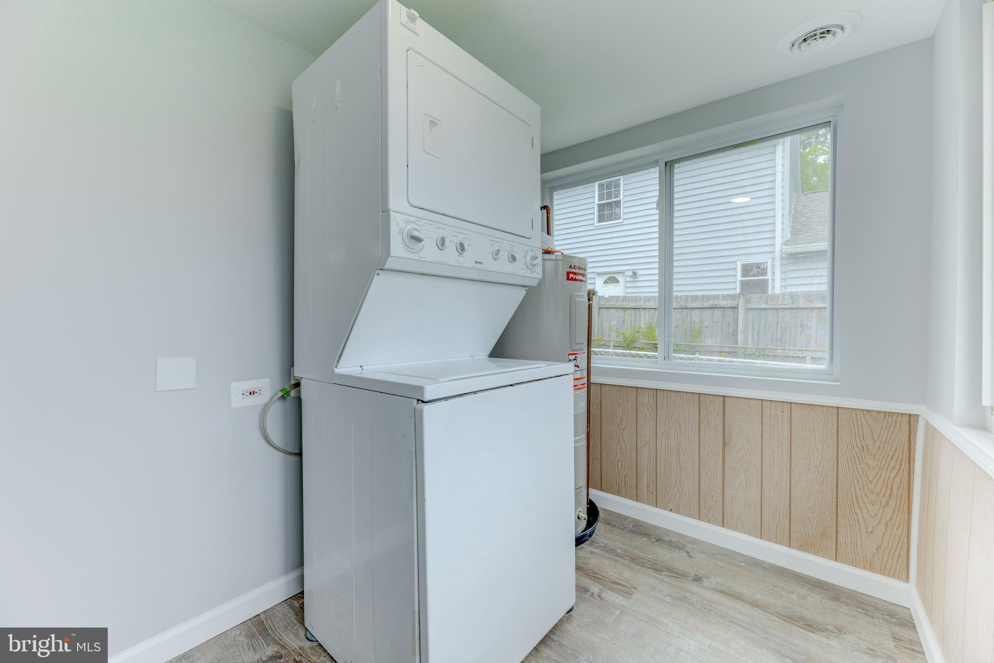 3911 3rd Street North Beach, MD 20714 - Photo 7 of 48 a utility room with dryer and washer