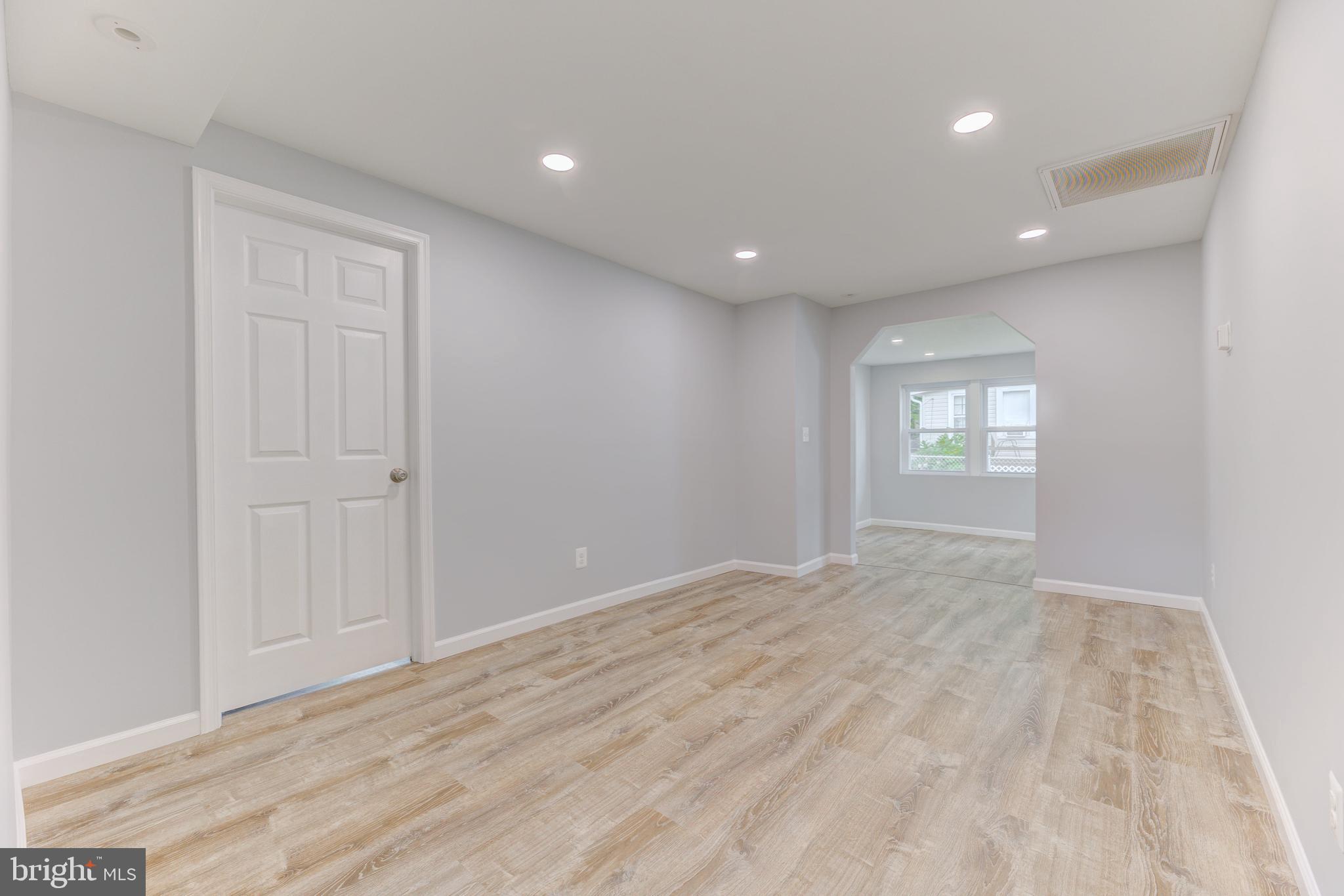 3911 3rd Street North Beach, MD 20714 - Photo 8 of 48 a view of an empty room and window
