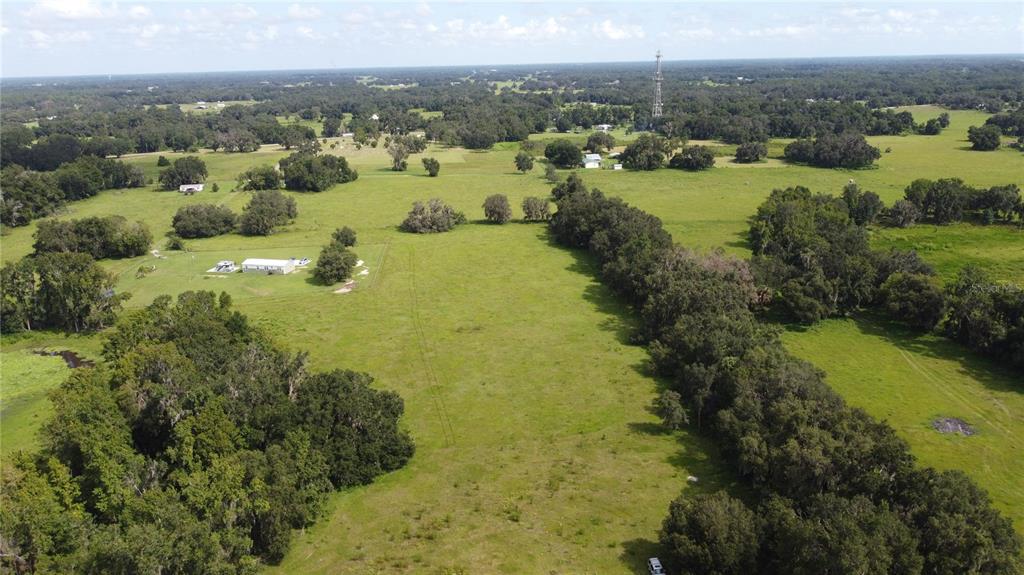 772 C Cr Webster, FL 33597 - Photo 9 of 19 a view of a lake with green field