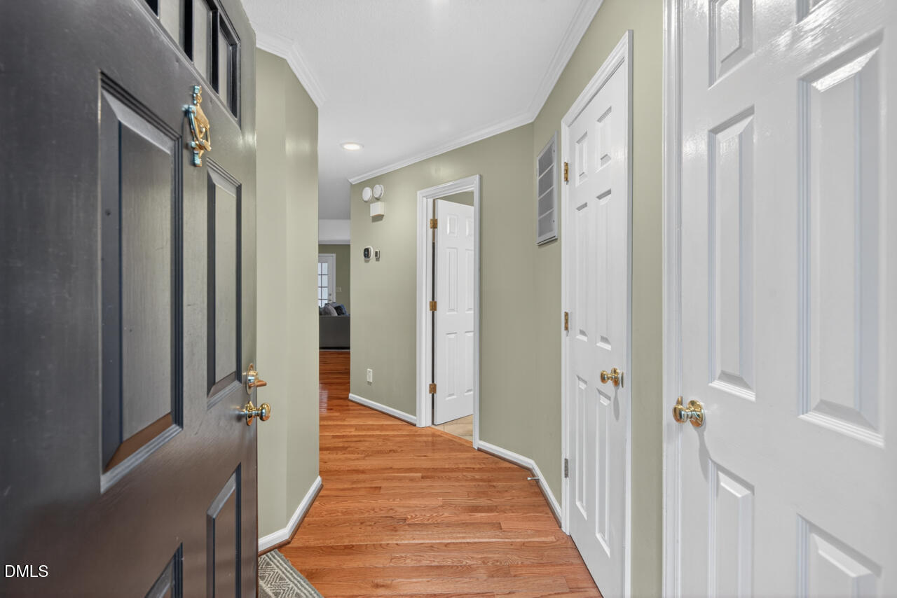 3307 Coachman's Way Durham, NC 27705 - Photo 3 of 50 a view of a hallway with wooden floor and a bathroom