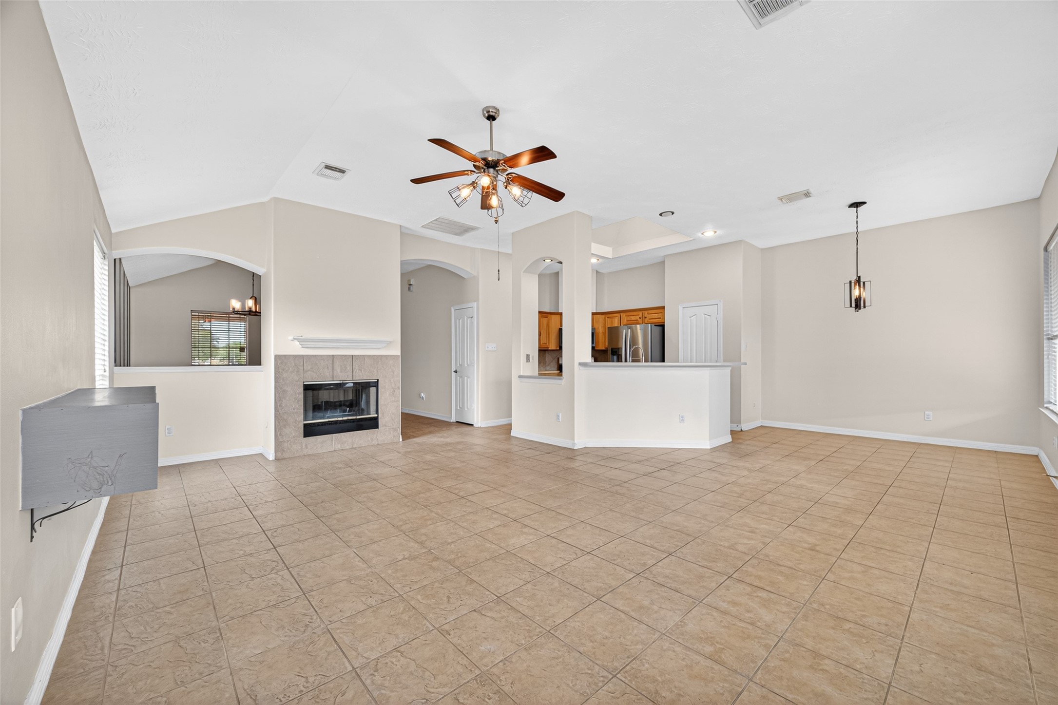 23914 Glengate Drive Spring, TX 77373 - Photo 12 of 49 a view of a livingroom with a fireplace and cabinet