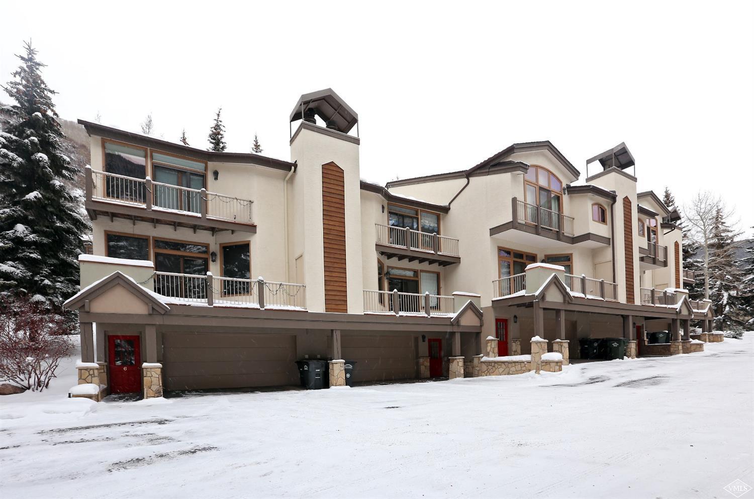 2335 Bald Mountain Road, Unit A5 Vail, CO 81657 - Photo 1 of 17 a front view of a house with a yard