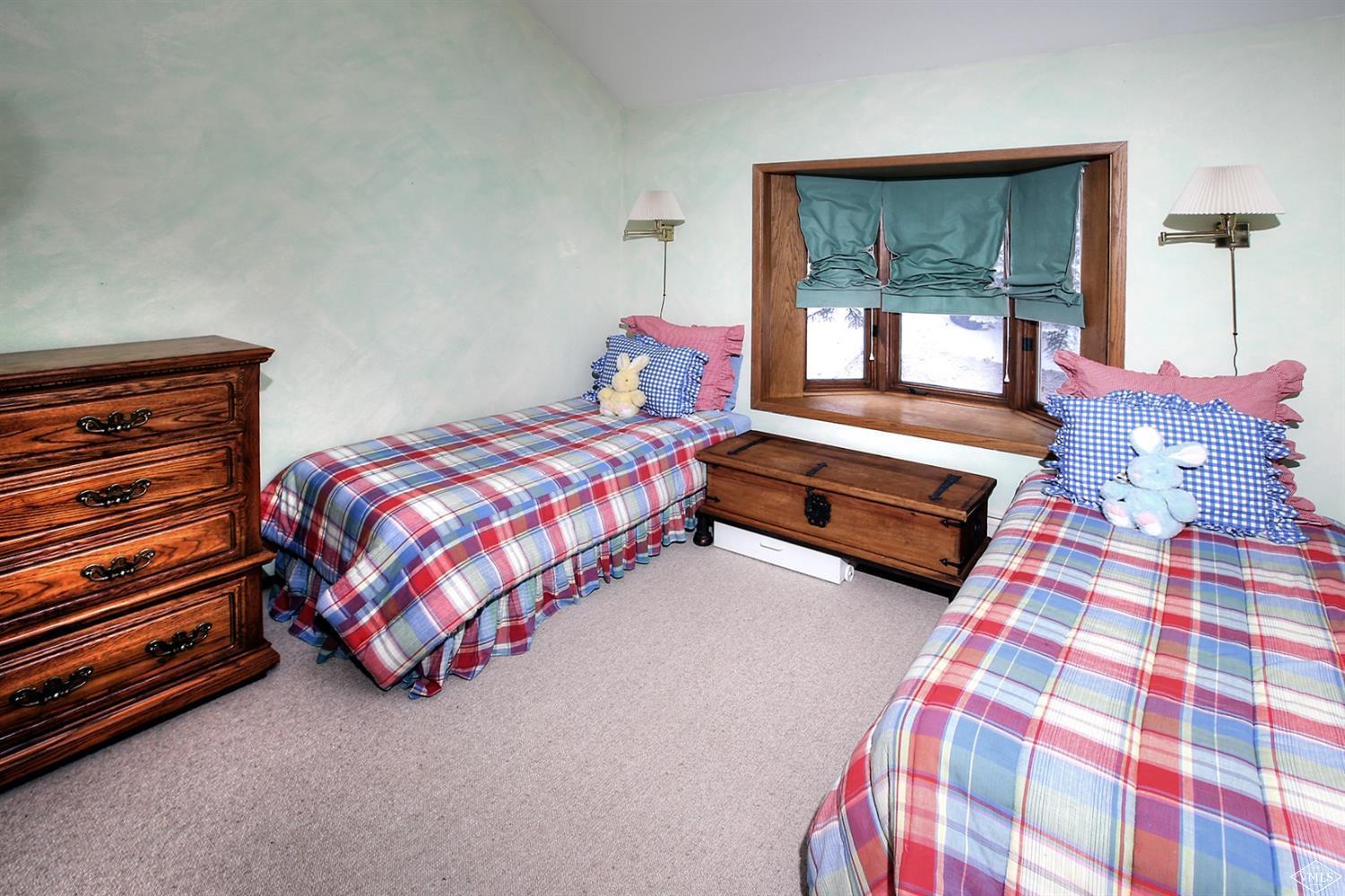 2335 Bald Mountain Road, Unit A5 Vail, CO 81657 - Photo 11 of 17 a bedroom with a bed and a window