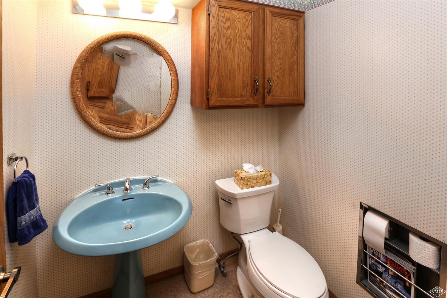 2335 Bald Mountain Road, Unit A5 Vail, CO 81657 - Photo 12 of 17 a bathroom with a toilet sink and mirror
