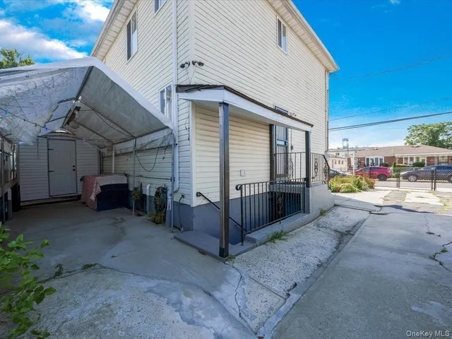 a view of a house with a parking space