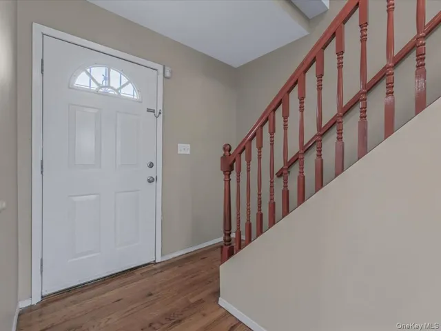 a view of staircase with wooden floor and stairs