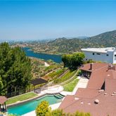 an aerial view of a house with a ocean view