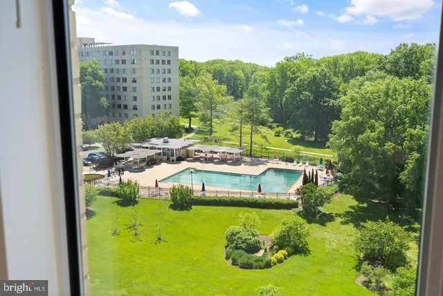 a view of a balcony with an outdoor space and seating area