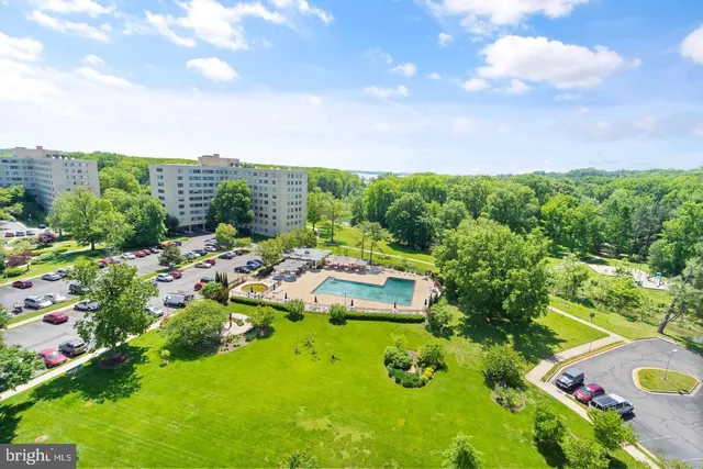 a view of a garden with a building in the background