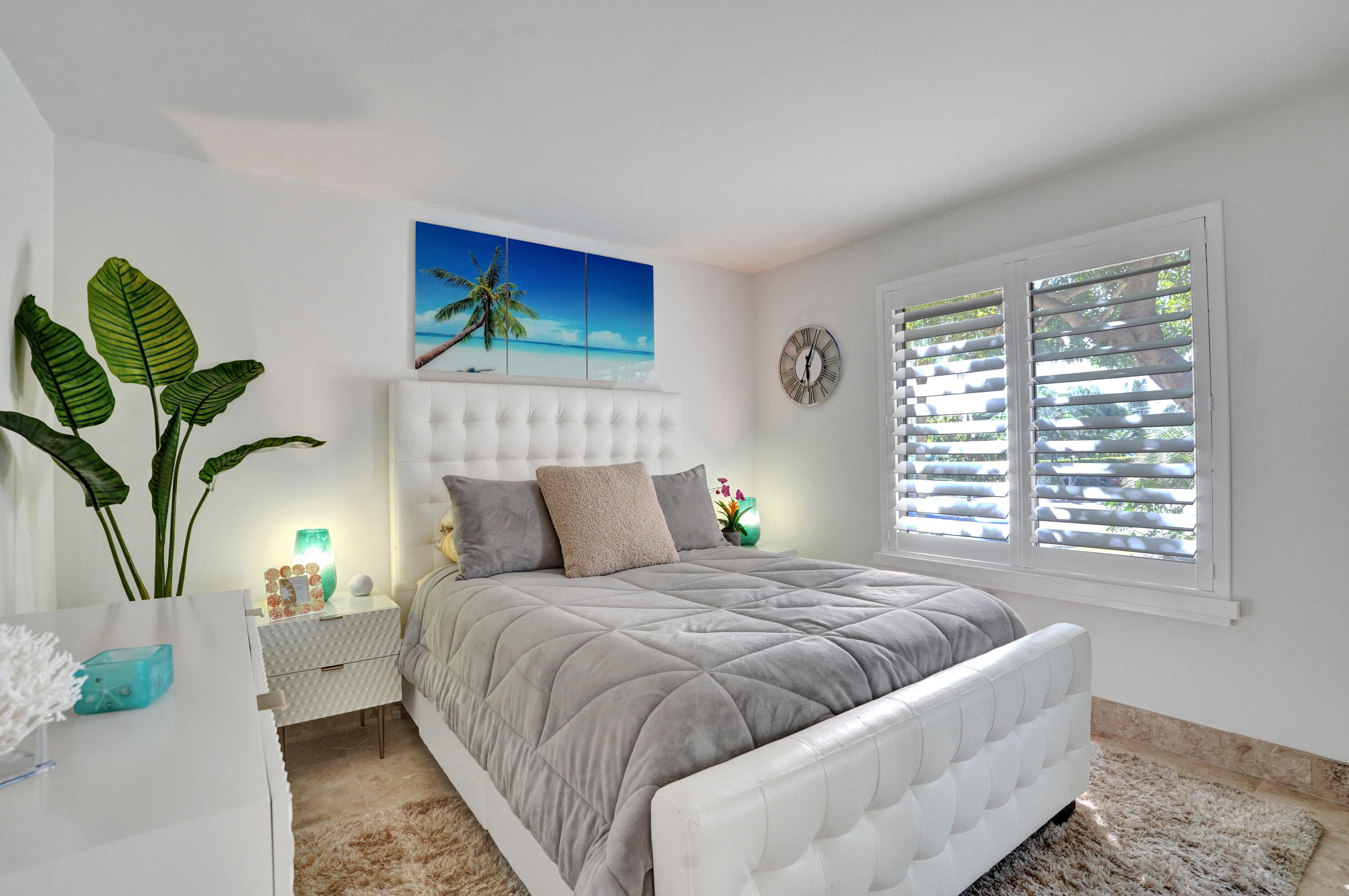 755 Dotterel Road, Unit 1112 Delray Beach, FL 33444 - Photo 30 of 64 a bedroom with a bed and a painting on the wall