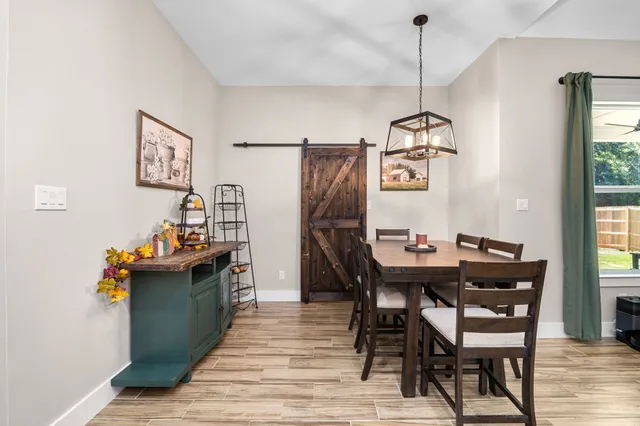 a white bath tub sitting next to a bathroom sink