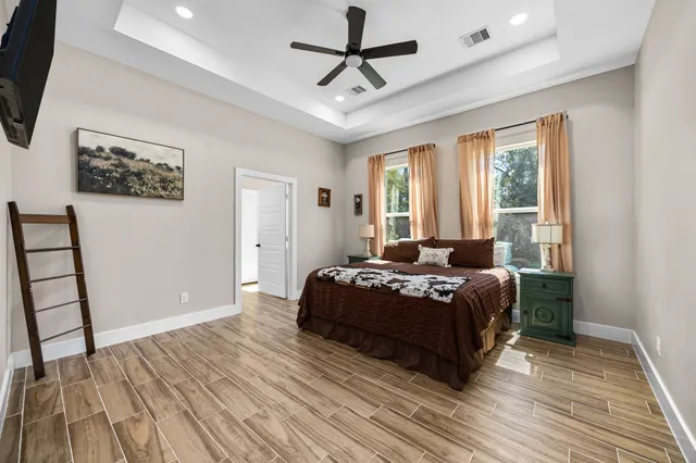 a spacious bathroom with a double vanity sink and a mirror