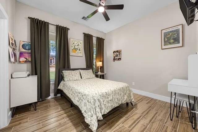 a room with wooden floors and furniture