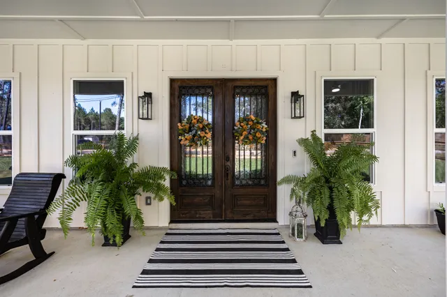 a living room with fireplace furniture and a flat screen tv