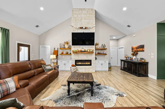 a large kitchen with stainless steel appliances kitchen island granite countertop a large island in the center