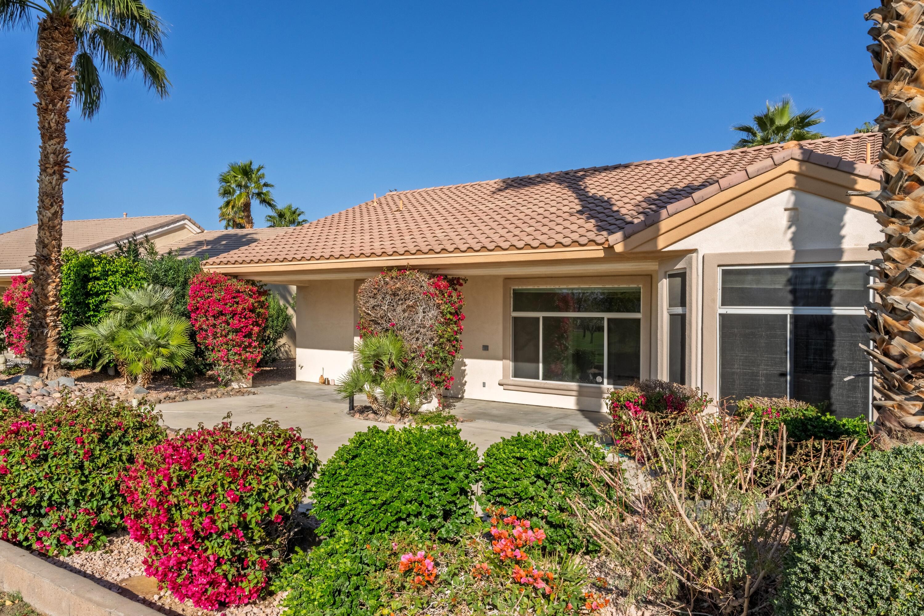35440 Moorbrook Road Palm Desert, CA 92211 - Photo 28 of 32 front view of a house with a flower garden
