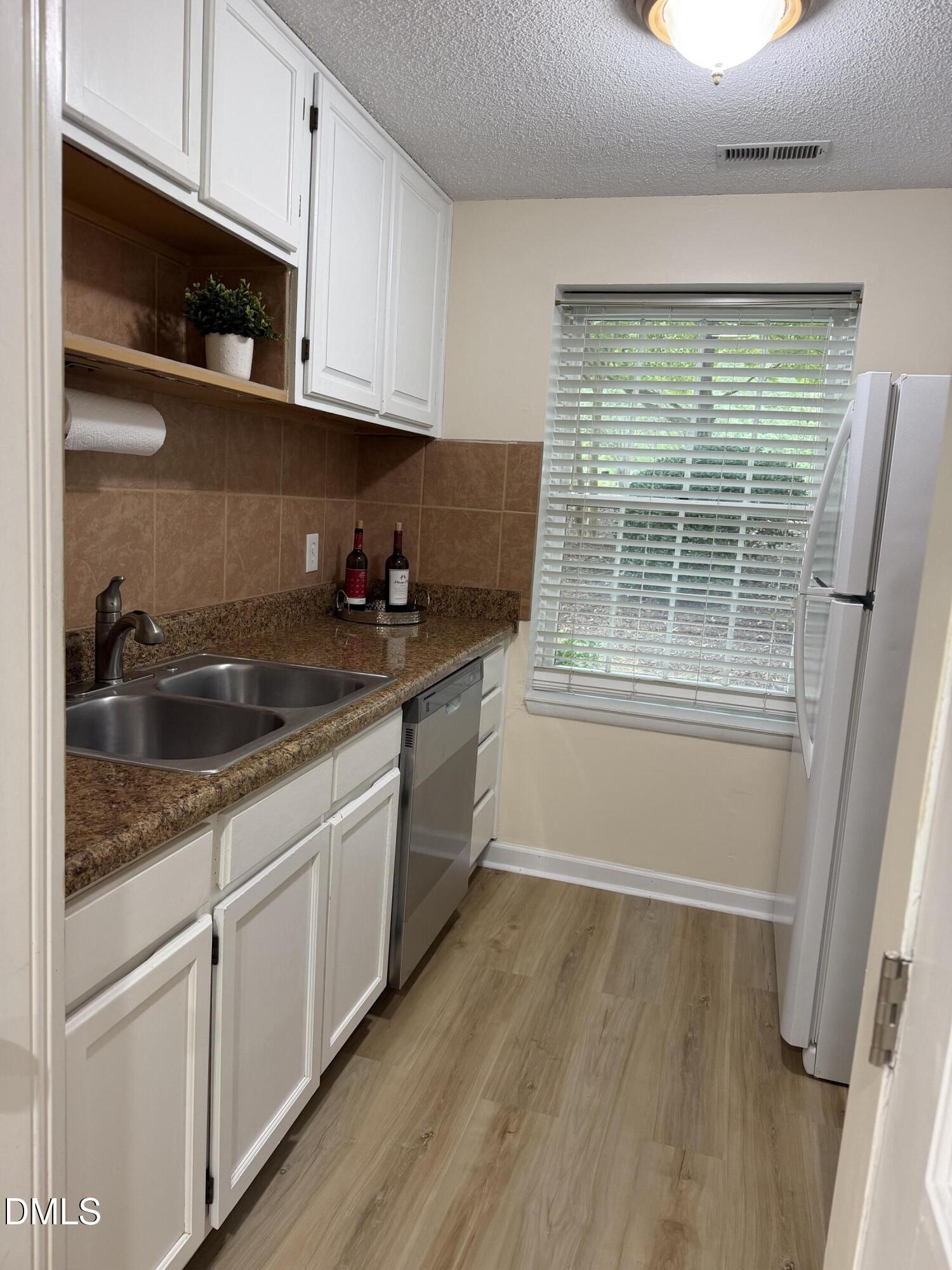 7766 Sandra Lane Raleigh, NC 27615 - Photo 19 of 29 Kitchen sink side