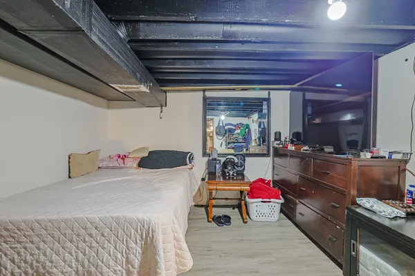 a room with furniture and a wooden floor