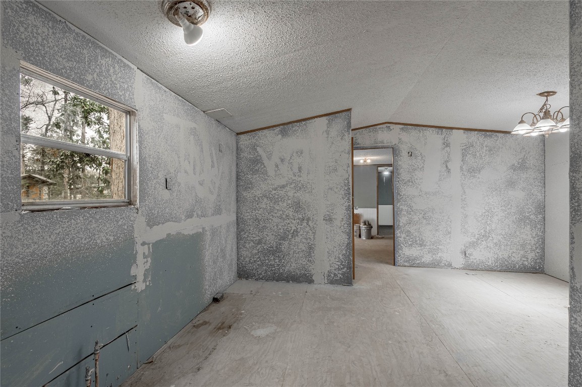 163 Magnolia Court Trinity, TX 75862 - Photo 11 of 25 a view of empty room with windows and refrigerator