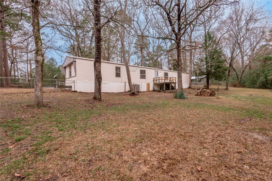 163 Magnolia Court Trinity, TX 75862 - Photo 2 of 25 a view of a house with a yard covered in snow