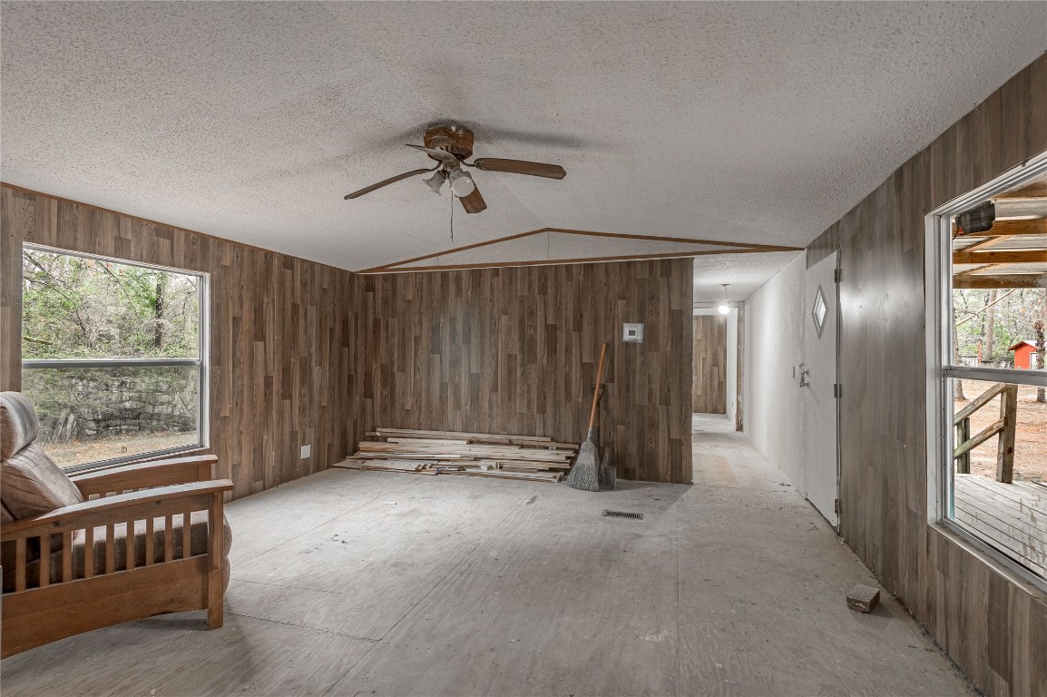 163 Magnolia Court Trinity, TX 75862 - Photo 9 of 25 a view of an empty room with windows & cabinet