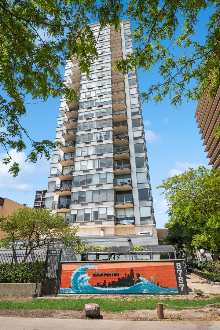 a front view of a multi story building with yard
