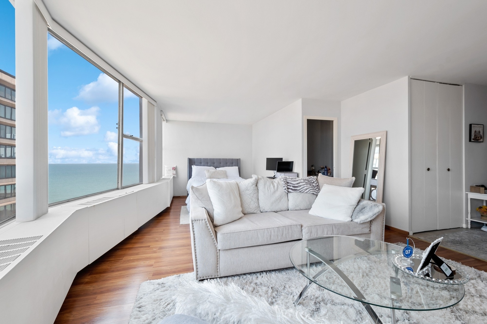 5757 North Sheridan Road, Unit 15G Chicago, IL 60660 - Photo 5 of 18 a living room with furniture and a window