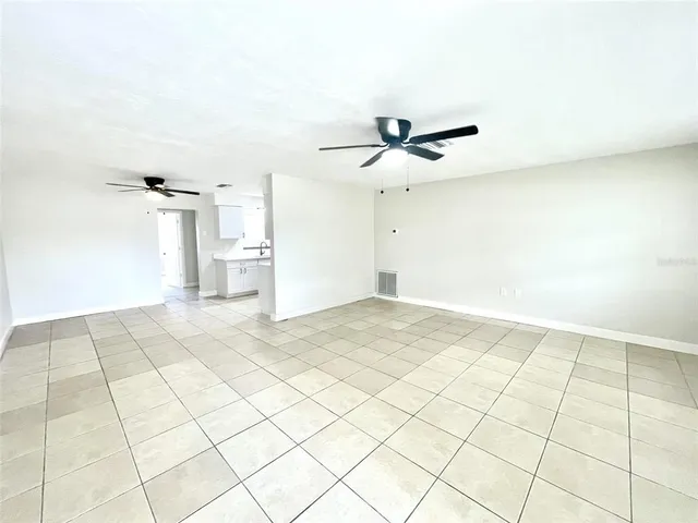 a view of a room with a large window